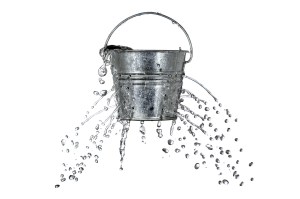 water is coming out of a bucket with holes